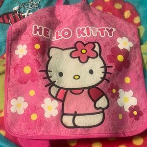 Hello kitty book/laptop bag very spacious have used it a couple times to travel